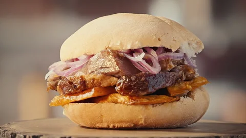 Traditional Peruvian Pan con Chicharron Pork Sandwich with Sweet Potato Stock-Footage 344983895
