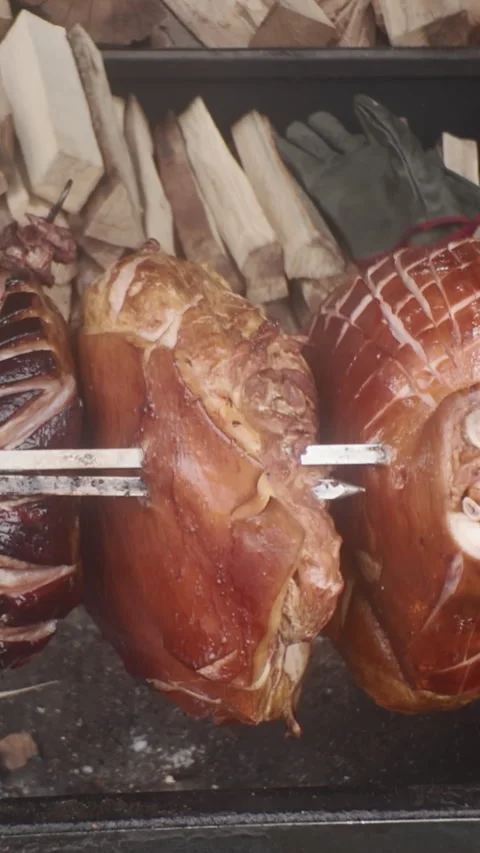 Traditional Prague Ham is cooked on spit... | Stock Video | Pond5