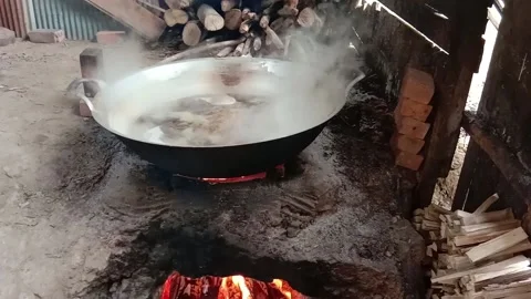 Traditional process of making palm sugar, cooking raw palm extract Stock Footage 142244243