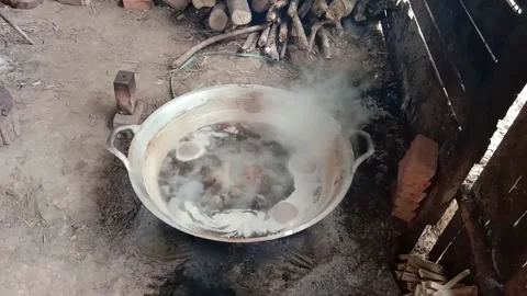 Traditional process of making palm sugar, cooking raw palm extract Stock Footage 142244332