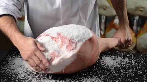Traditional processing of italian cured ham: salting by hand Stock Footage 63723039