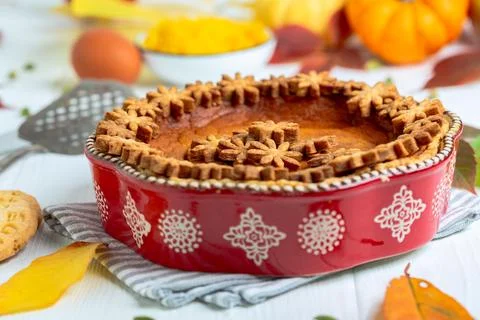 Traditional pumpkin pie in ceramic form. Stock Photos