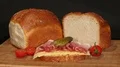 traditional raisin bread with ham and cheese on turntable 4k or 4k+ Resolution