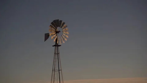 A traditional ranch windmill against a clear blue sky Stock Footage 171861449