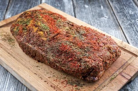 Traditional raw pulled pork piece of Bosten butt with spicy rub as closeup on Stock Photos