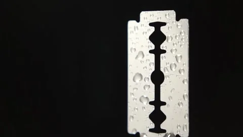 Traditional razor blade with water droplets on black background Stock Footage 158874341