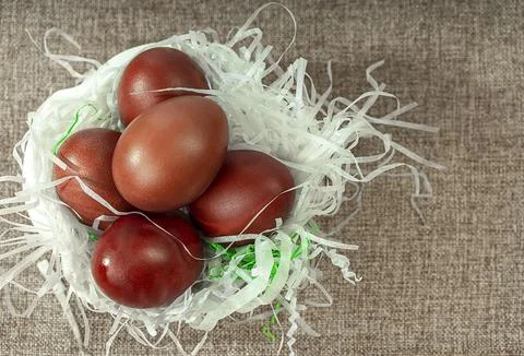 Traditional red Easter eggs in a plate. Viewpoint from above. Easter backgr.. Stock Photos