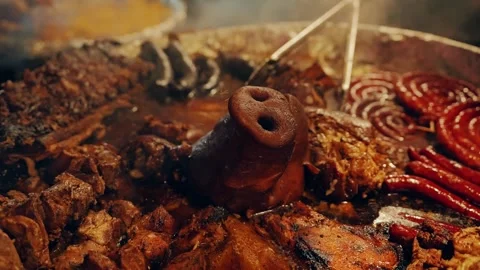 Traditional Roasted Pork Head and Smoked Meats, Old Riga Christmas Market Feast Stock Footage 341845153