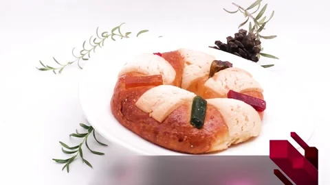 Traditional Rosca de Reyes bread in Mexico on white plate white background Stock Footage 314675073