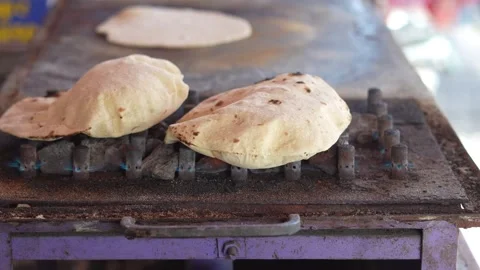 Traditional Roti Cooking on Open Flame Stove Close-Up Stock Footage 333070009