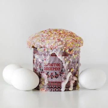 Traditional Russian Easter cake kulich, with white eggs Stock Photos