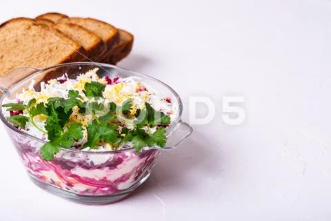 Traditional Russian layered betroot and herring salad (under a fur coat) in Stock Photos