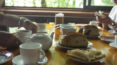 Traditional russian tea party. a table served with tea cups, teapots, on the Stock Footage 116133937