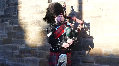 Traditional Scottish bagpiper in full dress code at Edinburgh Castle Stock Footage 59742052