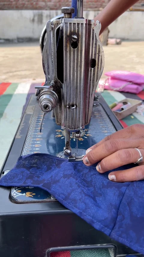 Traditional Sewing Process: Stitching Textile on a Classic Manual Sewing Machine 스톡 동영상 324893353