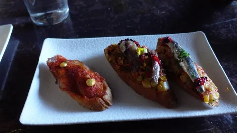 Traditional Spanish Basque bread snack called Pintxo Stock Footage 291987495