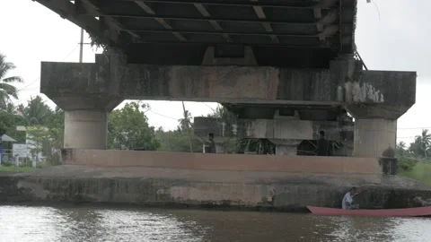 Traditional speedboat passing through the river, under the bridge Stock Footage 133448956