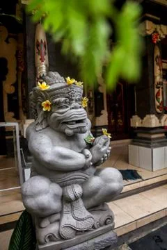 Traditional statue, an idol in the temple complex on the island of Bali, Indo Stock Photos