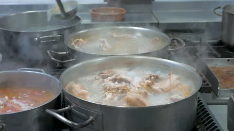 Traditional stew being cooked by a chef, no faces shown Stock Footage 148992348