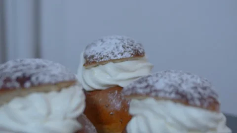 Traditional Swedish Semla served on rustic cutting board Stock Footage 102904929