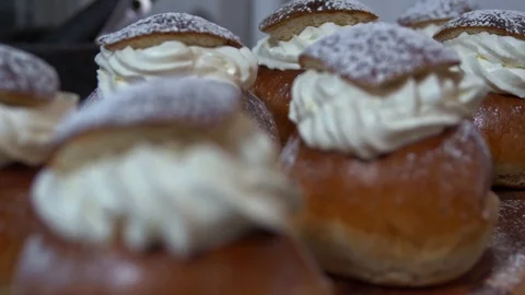 Traditional Swedish Semla served on rustic cutting board Stock Footage 102905016