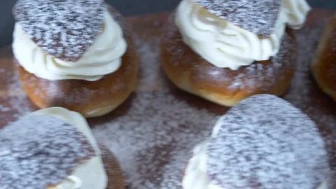 Traditional Swedish Semla served on rustic cutting board Stock Footage 102905129
