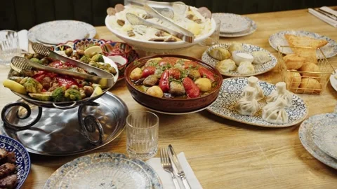 Traditional Table with Assorted Dishes and Beverages Stock Footage 302088597