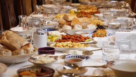 Traditional Table with Bread, Meat and Rustic Dishes Close-Up Stock Footage 339111313