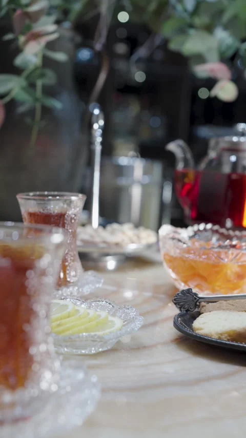 Traditional tea ceremony featuring black tea in armudu glasses, a glass tea.. Video stock 333915178