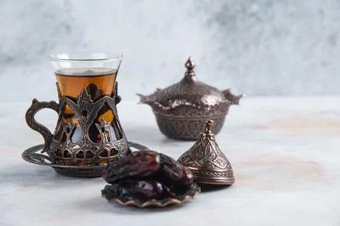 Traditional tea table cups on grey background Stock Photos
