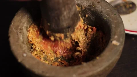 Traditional Thai Chili Paste Being Pounded in Stone Mortar Stock Footage 340248443
