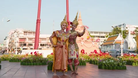 Traditional Thai Dancers Performing in Front of Historic City Landmark Stock Footage 340252061