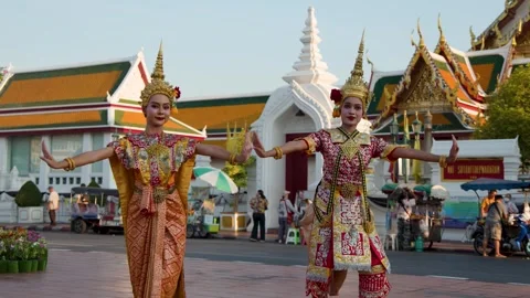 Traditional Thai Dancers Performing in Front of Wat Suthat Temple Stock Footage 345194775