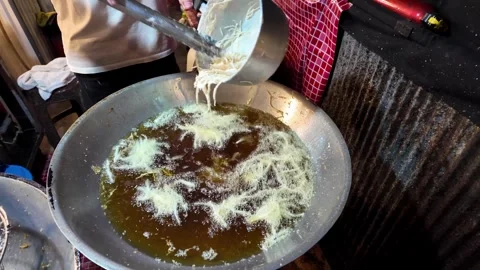Traditional Thai Funnel Cake Batter Being Poured into Hot Oil in Wok Vídeo Stock 340998737