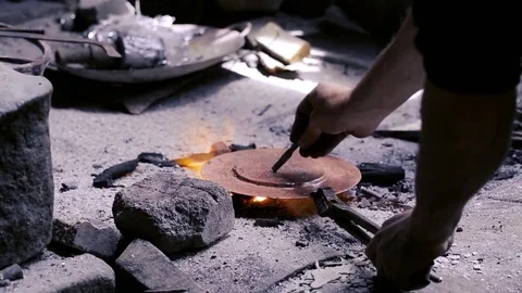 Traditional tinsmith work. Copper smith makes embossing artifacts from copper. D Stock Footage 76441922