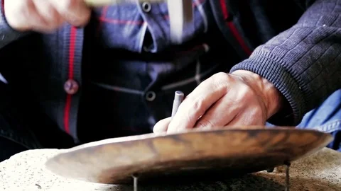 Traditional tinsmith work. Copper smith makes embossing artifacts from copper. D Stock Footage 76442084
