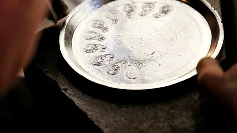 Traditional tinsmith work. Copper smith makes embossing artifacts from copper. D Stock Footage 76442093