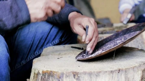 Traditional tinsmith work. Copper smith makes embossing artifacts from copper. D Stock Footage 76442144
