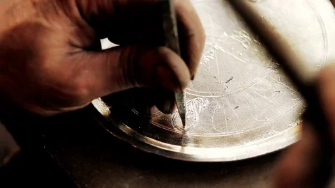 Traditional tinsmith work. Copper smith makes embossing artifacts from copper. D Stock Footage 76442208
