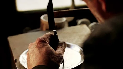 Traditional tinsmith work. Copper smith makes embossing artifacts from copper. D Stock Footage 76442233