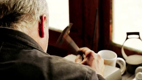 Traditional tinsmith work. Copper smith makes embossing artifacts from copper. D Stock Footage 76442242