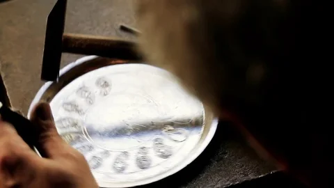Traditional tinsmith work. Copper smith makes embossing artifacts from copper. D Stock Footage 76442259