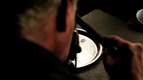 Traditional tinsmith work. Copper smith makes embossing artifacts from copper. D Stock Footage 76442363