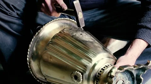 Traditional tinsmith work. Copper smith makes embossing artifacts from copper. D Stock Footage 76442402