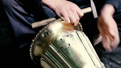 Traditional tinsmith work. Copper smith makes embossing artifacts from copper. D Stock Footage 76442443