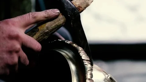 Traditional tinsmith work. Copper smith makes embossing artifacts from copper. D Stock Footage 76442459