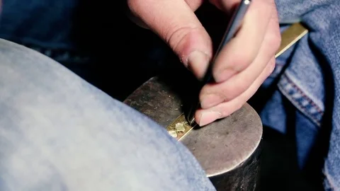 Traditional tinsmith work. Copper smith makes embossing artifacts from copper. D Stock Footage 76442491