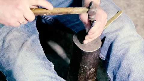 Traditional tinsmith work. Copper smith makes embossing artifacts from copper. D Stock Footage 76442495