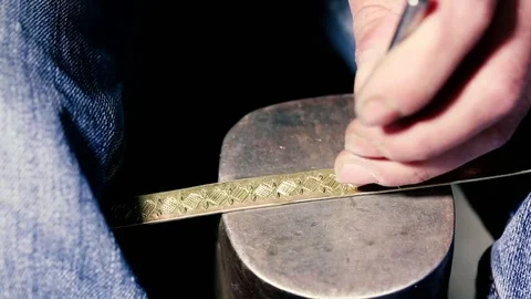 Traditional tinsmith work. Copper smith makes embossing artifacts from copper. D Stock Footage 76442548
