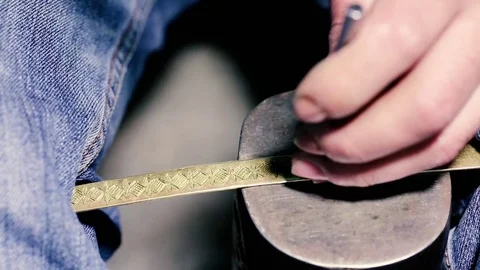Traditional tinsmith work. Copper smith makes embossing artifacts from copper. D Stock Footage 76442577